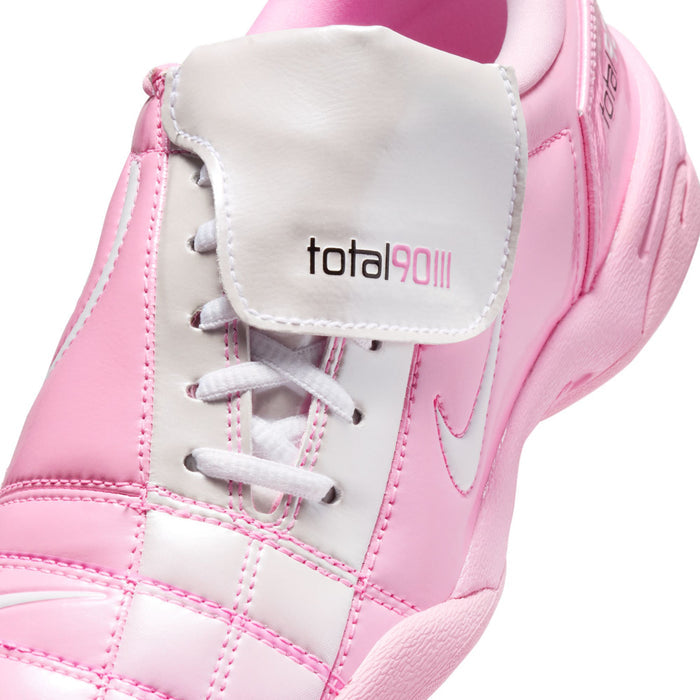 Pink women's sneakers with white laces and total90ii patch on tongue