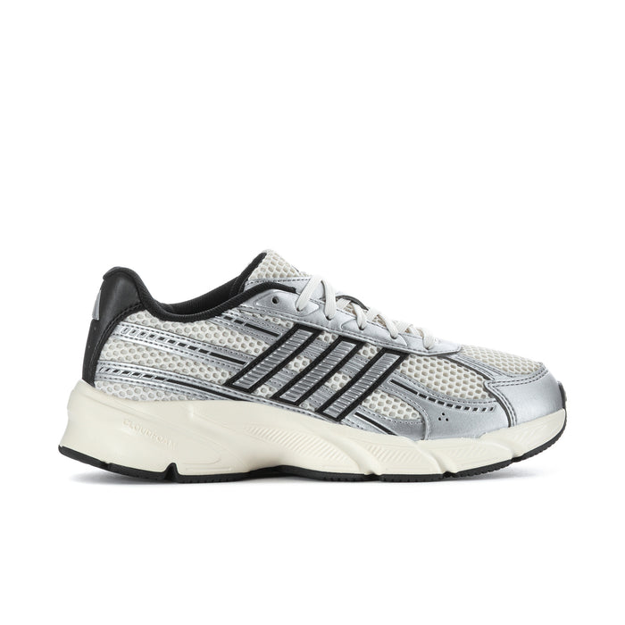 Women’s running shoes in chalk white and silver with black accents, lace-up