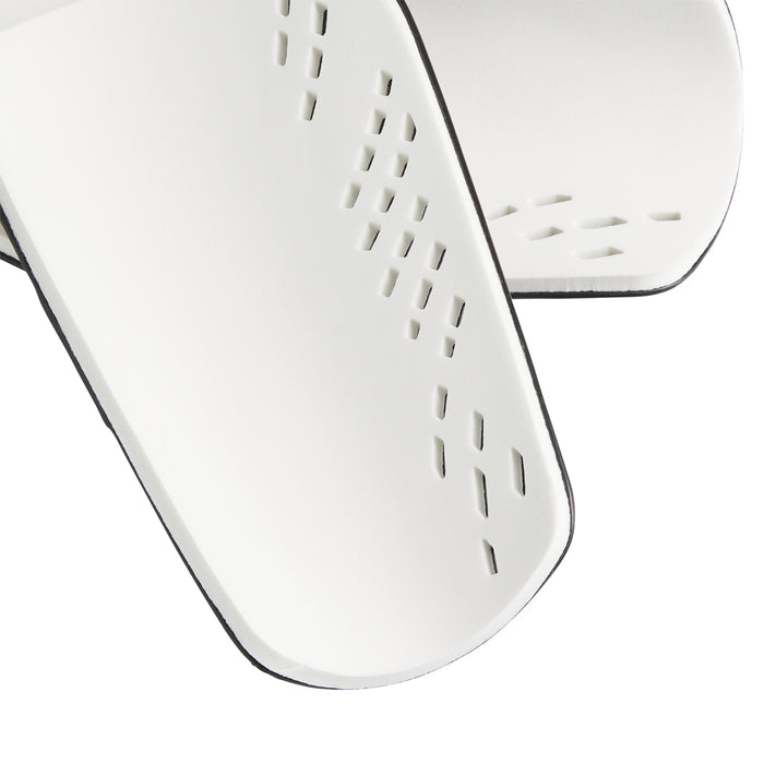 White slip-in shin guard with perforated vent cutouts and curved edges