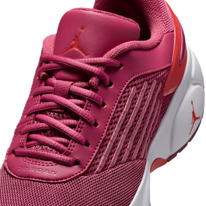 Close-up of berry pink lace-up running shoe upper with Jordan on the tongue