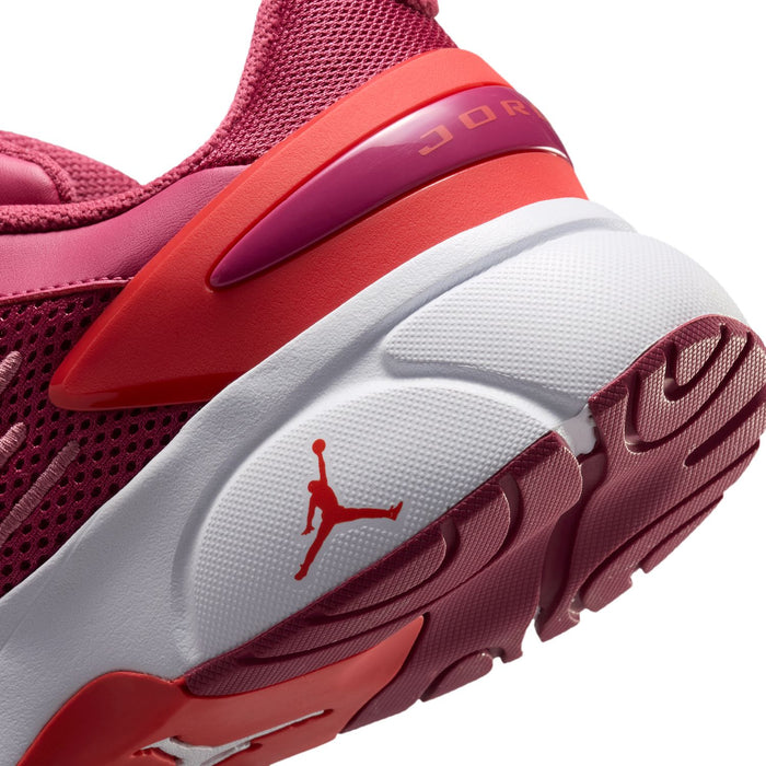 Close-up of berry pink running shoe heel with Jumpman logo and white traction sole