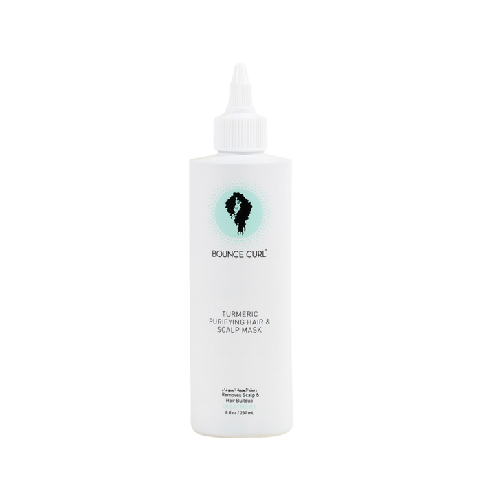A white squeeze bottle of Bounce Curl Turmeric Purifying Hair & Scalp Mask with a pointed tip applicator