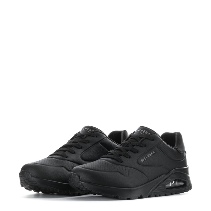 Pair of women's black SKECHERS lace-up sneakers with logo accents