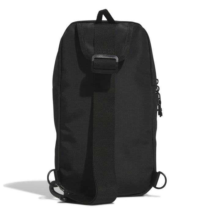 Black utility sling bag back view with top handle, buckle strap, and cinch cords