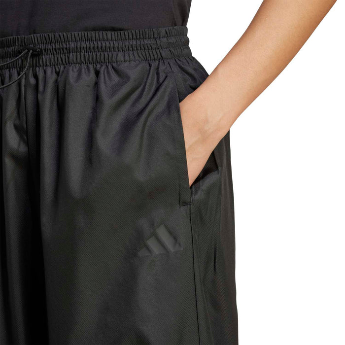 Black woven cargo pants with elastic waistband and side pocket detail