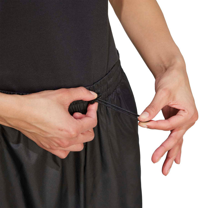 Black utility pants with elastic waistband and drawstring/cord at hem