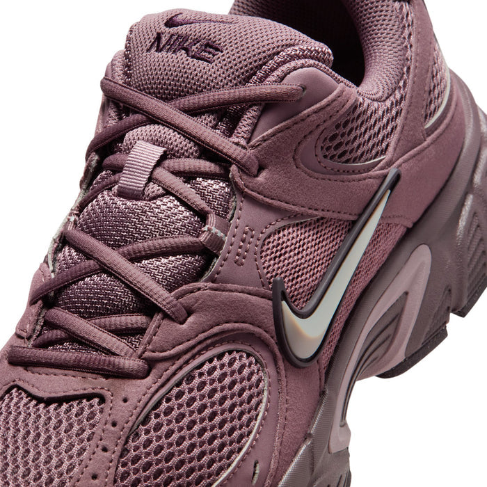 Men's sneaker upper close-up in dusty mauve with lace panel and NIKE swoosh