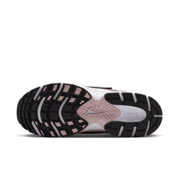 Women’s sneakers outsole view with black traction tread and light pink midsole