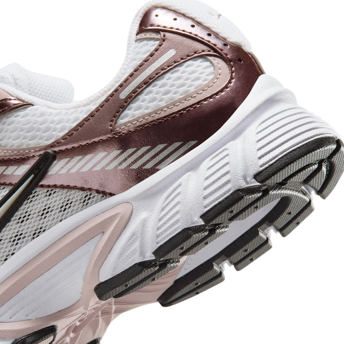 Women’s sneaker close-up of toe and side: white mesh with brown and rose accents