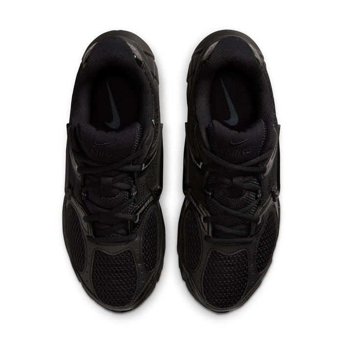 Black womens wide athletic sneakers, front view with lace-up and Nike Swoosh on tongue.