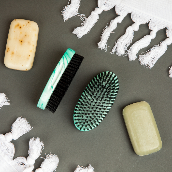 Bounce Curl brushes sit next to bars of soap