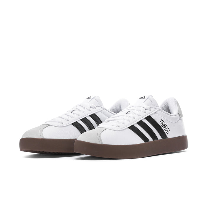Women's white adidas sneakers, black stripes on sides, brown gum soles; two-shoe view
