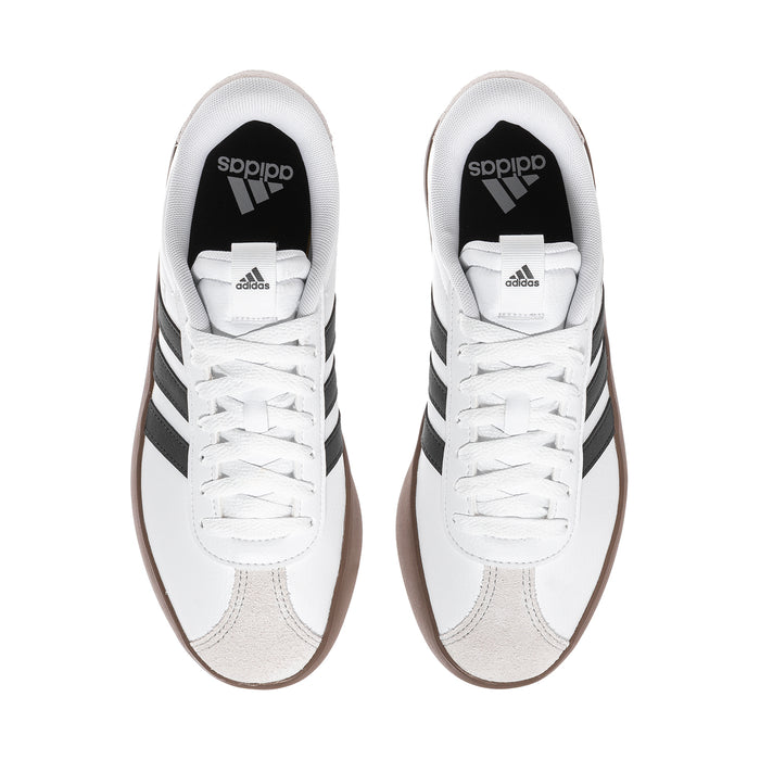 Women's white adidas sneakers viewed from above, black stripe accents and lace-up uppers