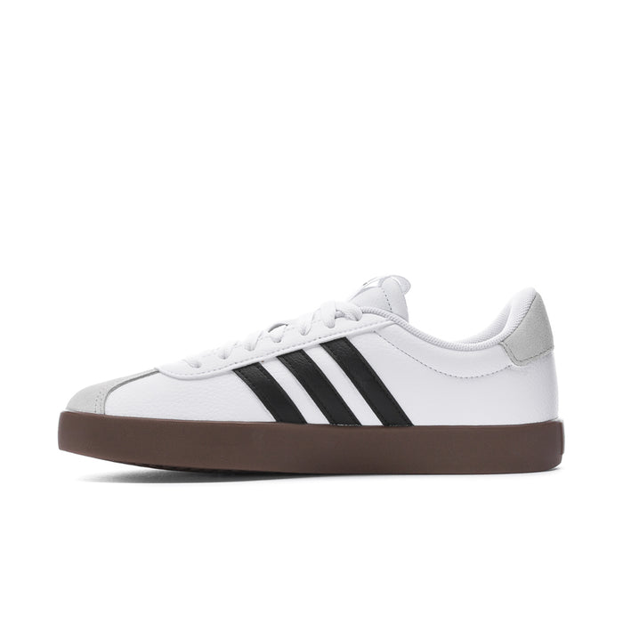 Women's white adidas sneakers with black 3-Stripes and brown gum outsole; side view