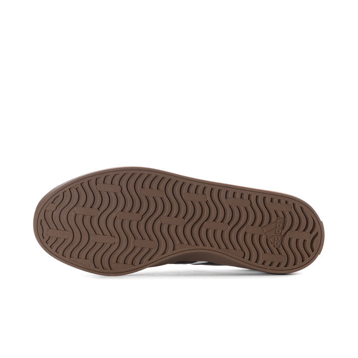 Women's adidas sneaker outsole, brown tread pattern with grippy circular grooves