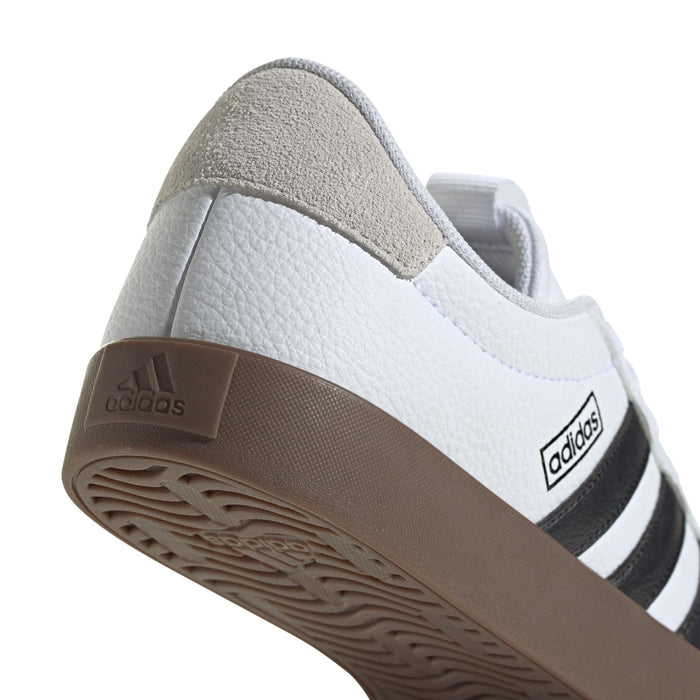 Women's adidas sneaker heel and side view with brown sole, adidas logo label