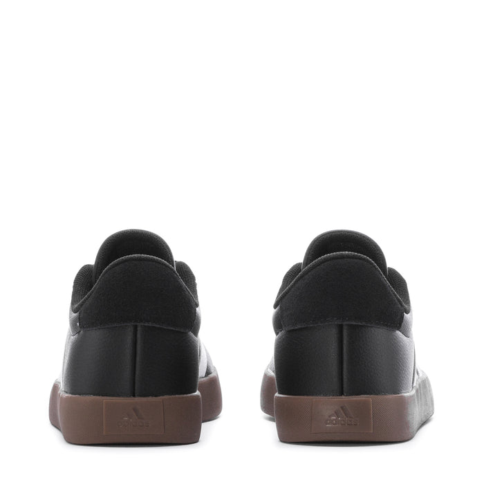 Black youth sneakers with rounded heel, gum-brown outsole and back pull tab