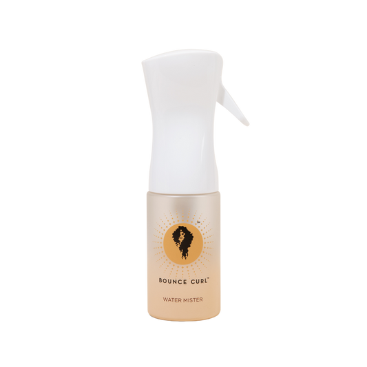 Bounce Curl water mister bottle with white top and beige body on a white background