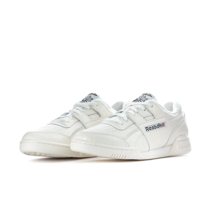Pair of white low-top lace-up sneakers with Reebok branding on the sides.