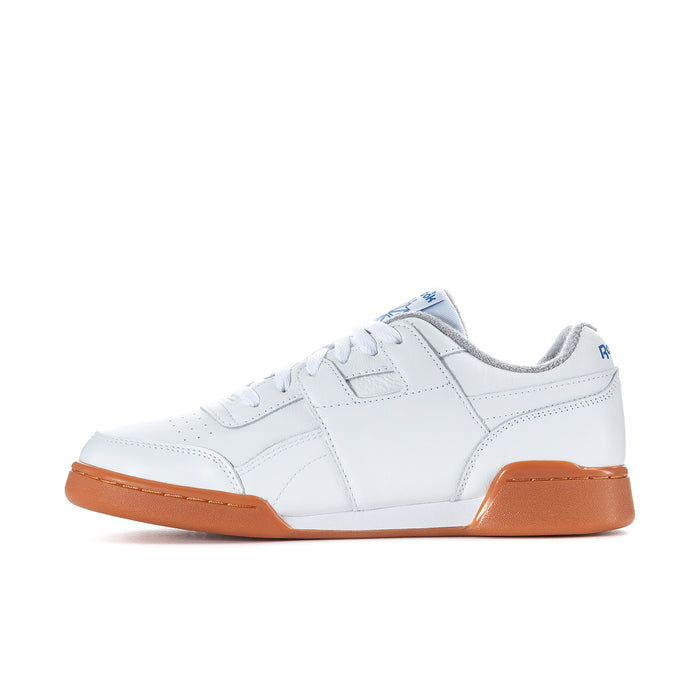 White Reebok low-top sneaker with orange side panel and lace-up design