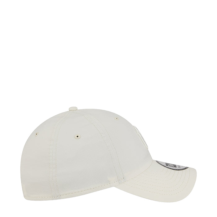 Light chrome white cap side profile with tonal logo and stitched ventilation
