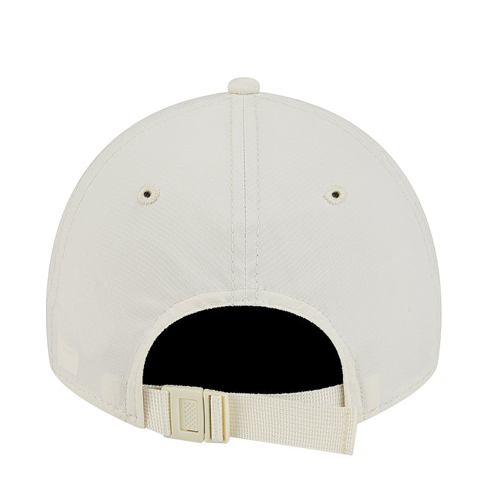 Light chrome white cap showing black inner lining and adjustable fabric strap
