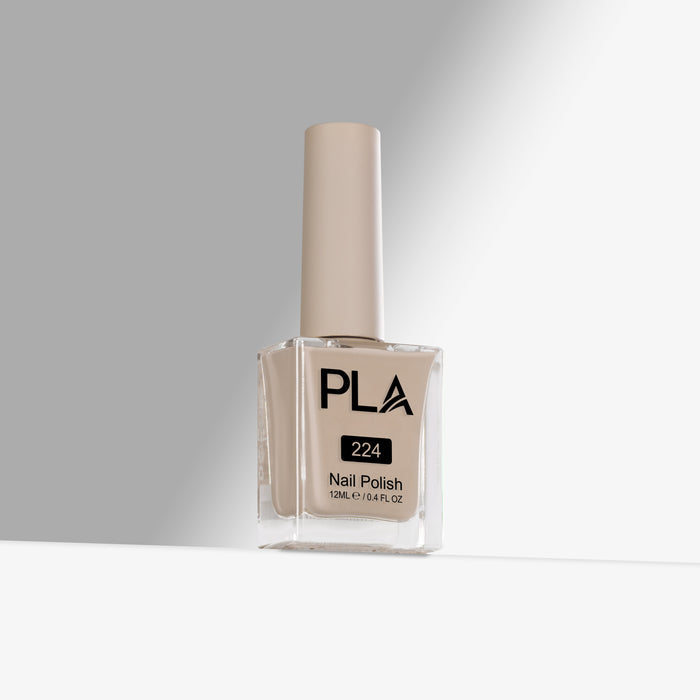 Beige nail polish bottle with 'PLA' branding on a gray background