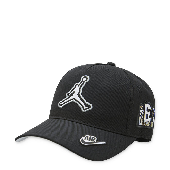 Youth Jordan black curved brim cap with white Jumpman logo and Air label