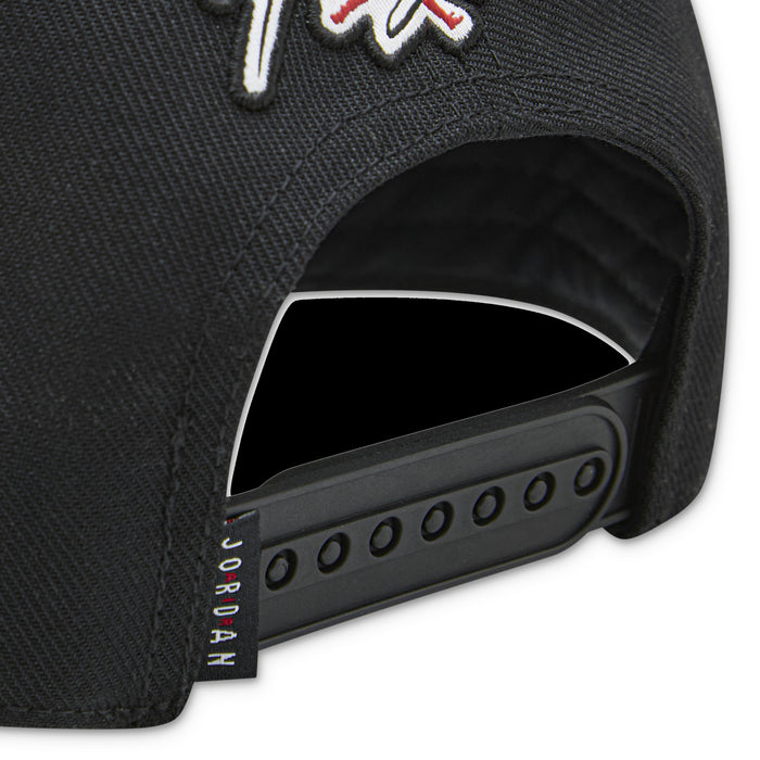 Youth Jordan black cap close-up of snapback strap and perforated side panel