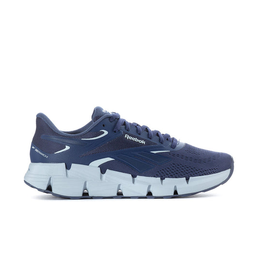 Men's navy Reebok running shoe with white outsole and blue side overlays