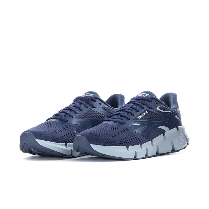 Men's navy Reebok running shoe side view with laces and white tread sole