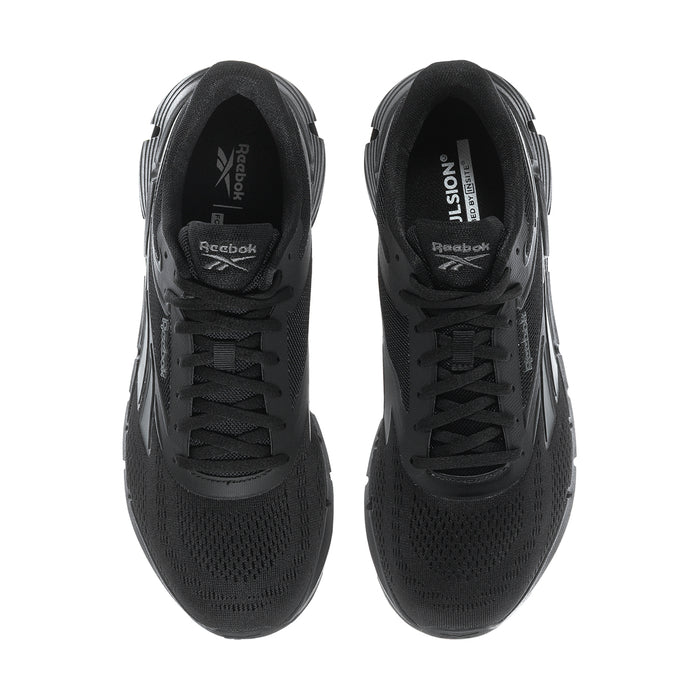 Men's black lace-up shoes with Reebok branding inside tongue and padded collar