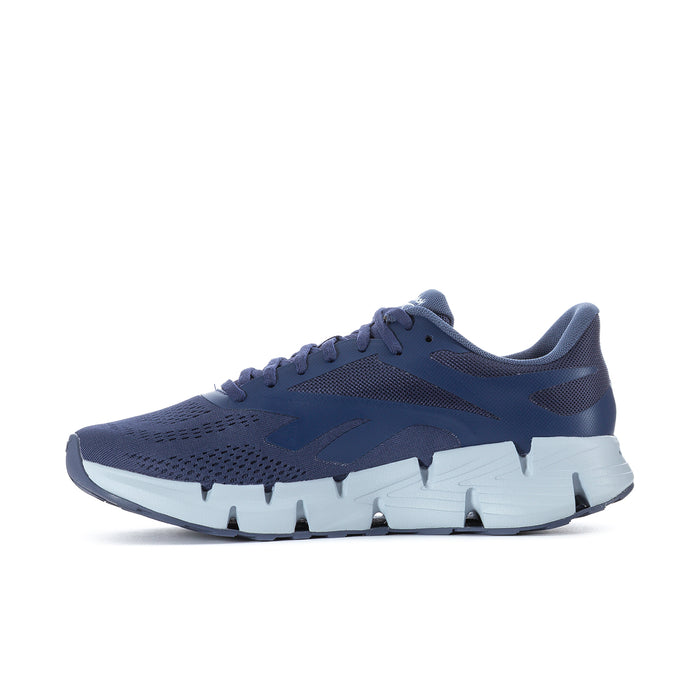 Men's navy Reebok running shoe angled side view with white outsole and spikes
