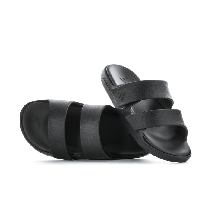 Women's black slide sandals, side view with layered adjustable straps