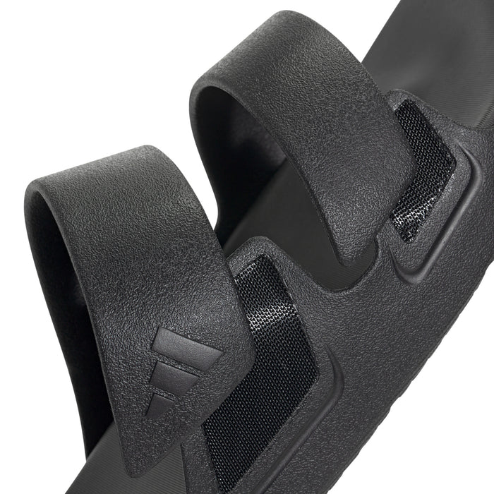 Black slide sandal close-up of padded straps and V embossed logo